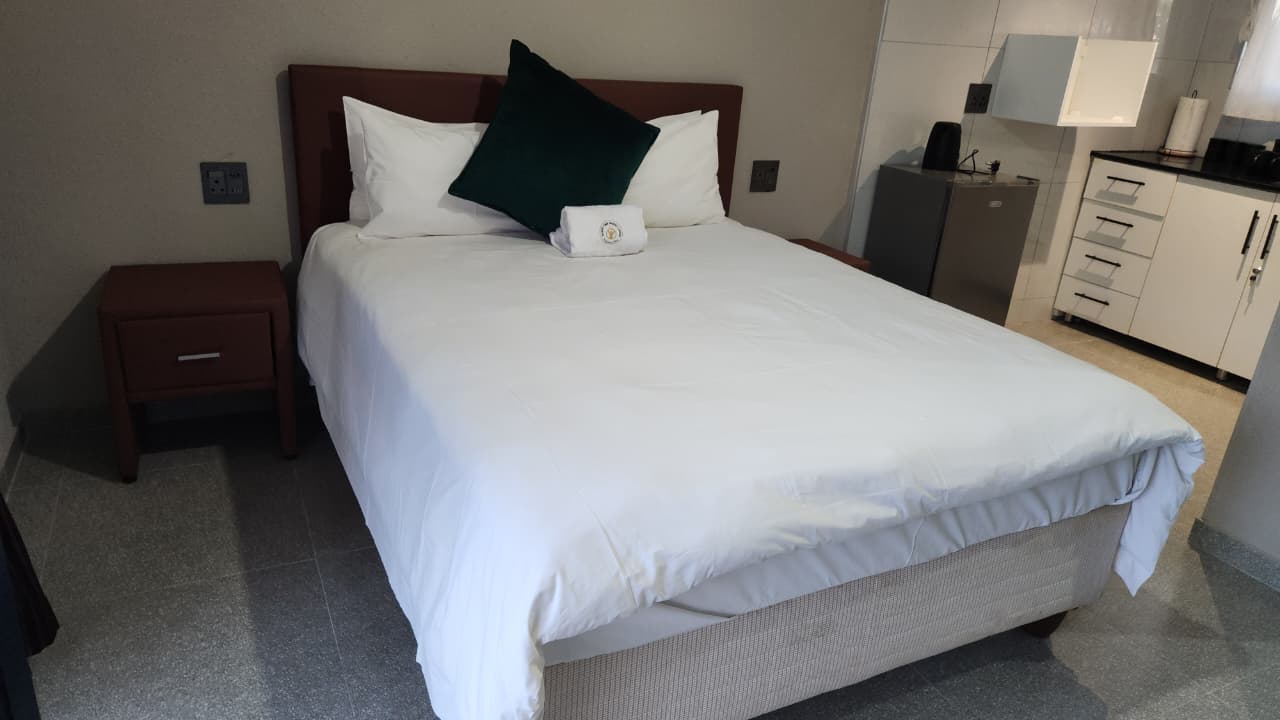 Suite 2 - wide angle showing bed and bathroom entrance